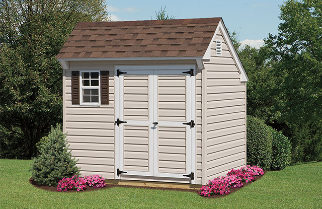 mini quaker shed with brown window shutters and roof in a maryland black yard