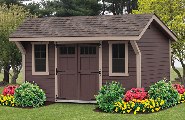 new haven series shed surrounded by flowers