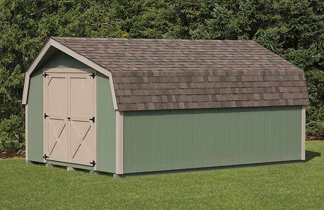 mini barn style shed with a curved roof  mini barn style shed with curved roof and large white doors sitting in an open field in front of trees in marlyand
