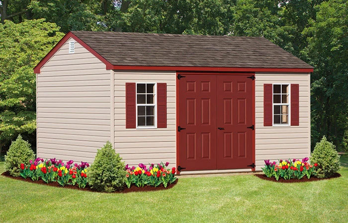 workshop storage shed featuring red double door and red roof trim