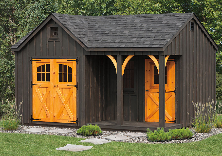 board and batten shed build with natural wood details and small porch