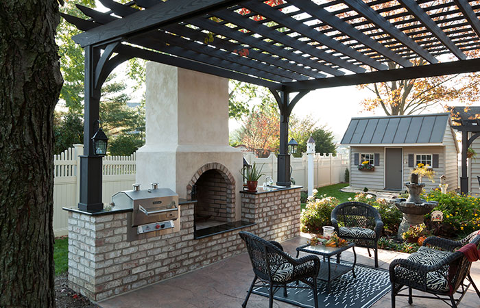 dark grey pergola over backyard patio at md home