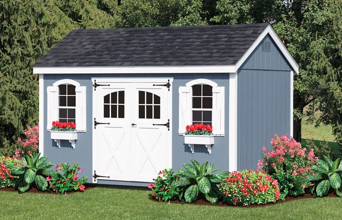 garden shed with blue siding and window boxes