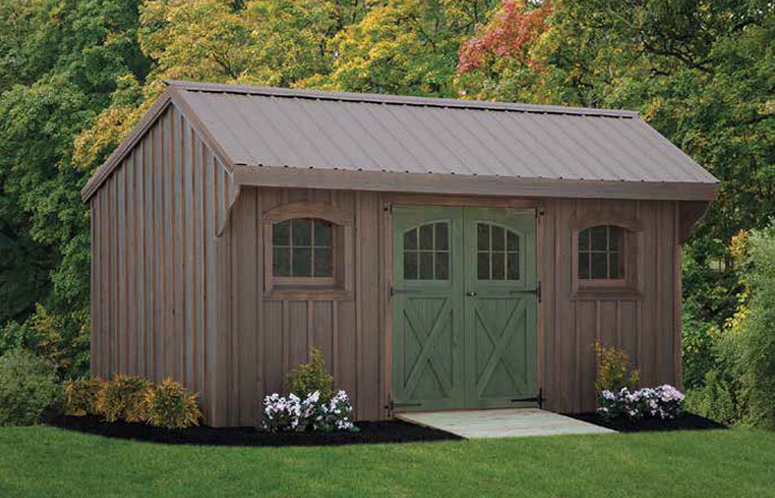 weathered gray quaker series shed with dark green weathered door