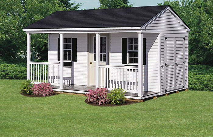 white backyard storage shed with gable porch